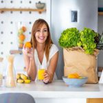 woman posing with an orange